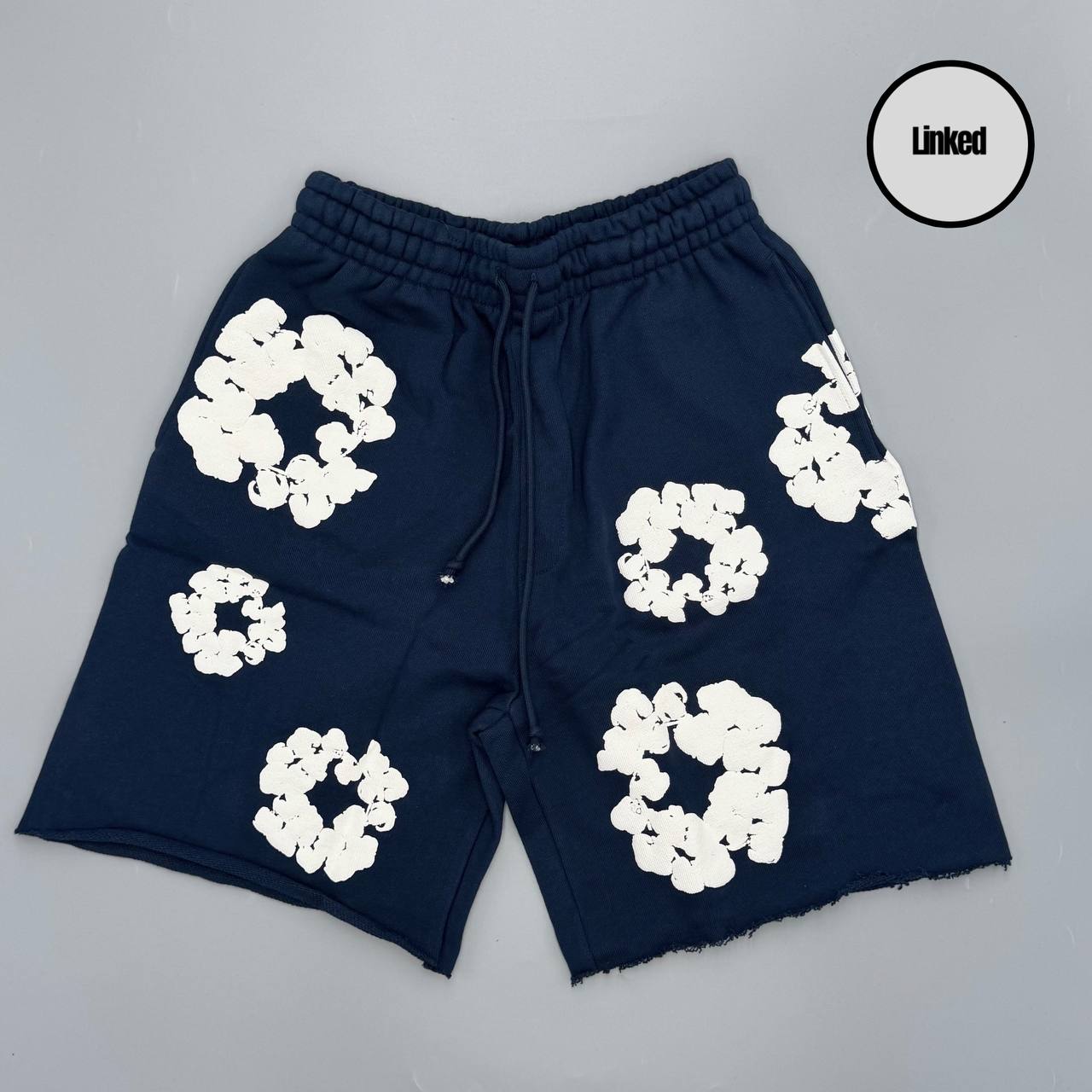 DENIM TEARS NAVY SHORTS