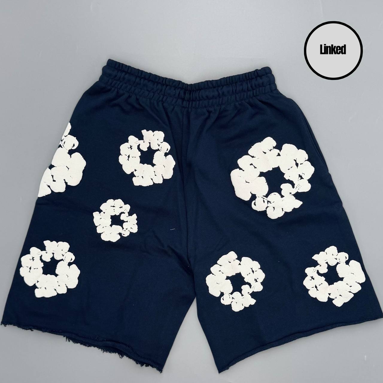 DENIM TEARS NAVY SHORTS
